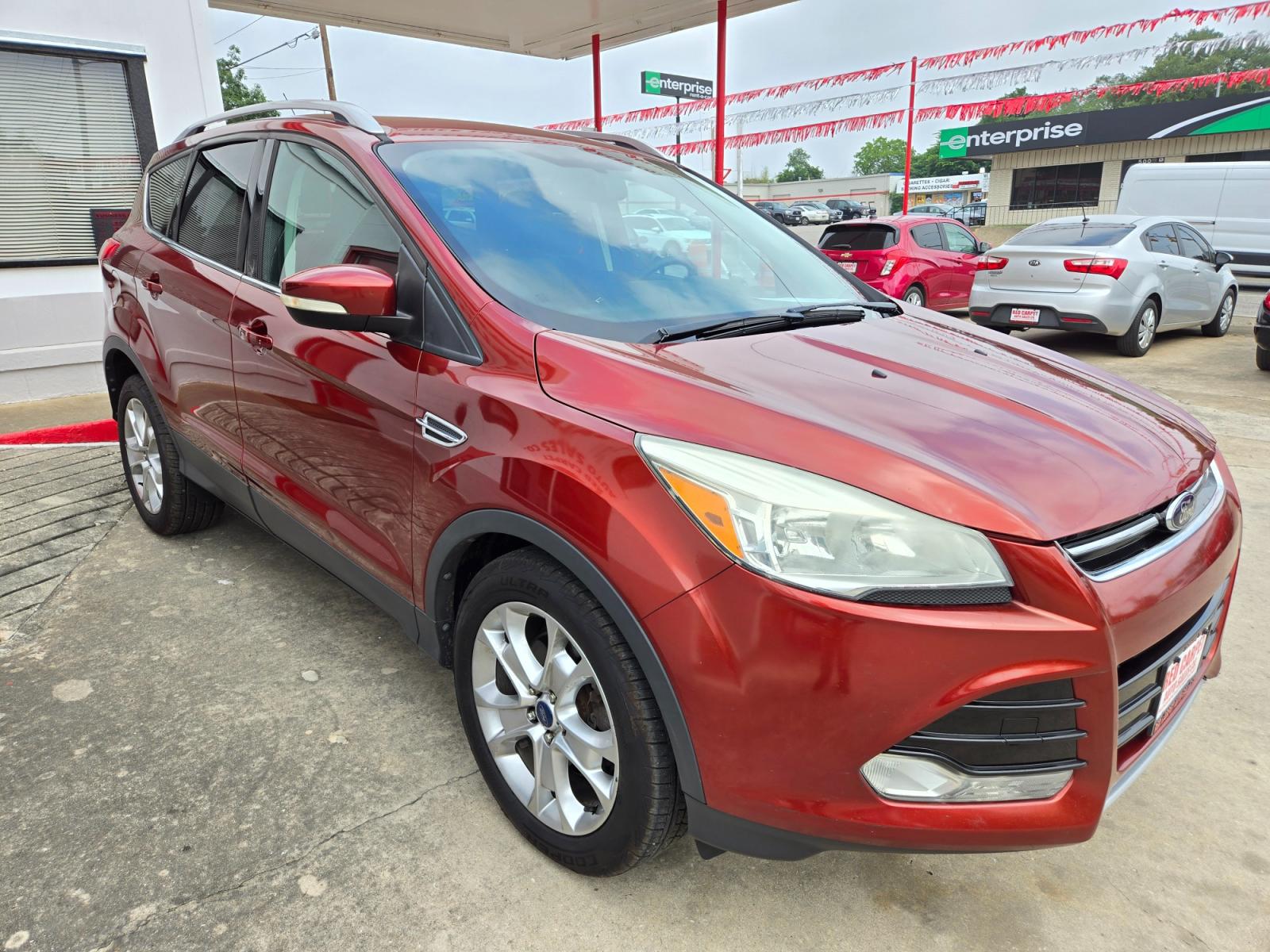 2014 Orange Ford Escape Titanium 4WD (1FMCU9JX7EU) with an 1.6L L4 DOHC 16V engine, 6-Speed Automatic transmission, located at 503 West Court, Seguin, TX, 78155, (830) 379-3373, 29.568621, -97.969803 - 2014 Ford Escape Titanium 4WD with a 1.6L L4 DOHC 16V, Automatic, Tilt, Cruise, AM/FM/CD Touchscreen Stereo, Power Windows, Locks, Seat and Side Mirrors, Leather Seating, Bluetooth, Dual Climate Control, Rear A/C, Rear Camera, Bumper Sensors, Alloy Wheels, Rear Defroster, Rear Wiper and more!! - Photo #1